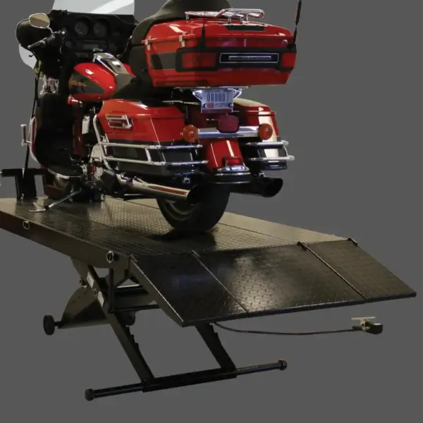 Rear view of a motorcycle positioned on the Forward Lift 1000MCL portable motorcycle and ATV lift, highlighting the extended ramp and sturdy lift platform.
