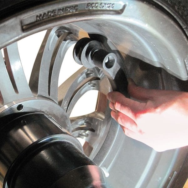 Technician adjusting Rotary R155 Pro 3D Wheel Balancer for precise measurement